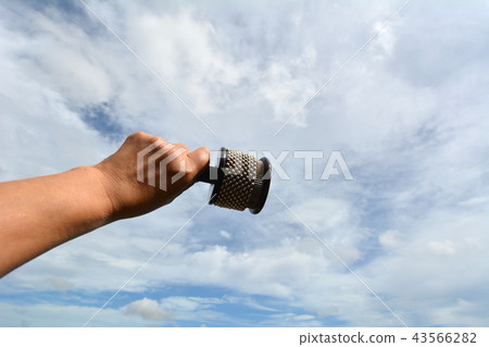 Hand holding an instrument, Kabasa, image material 43566282