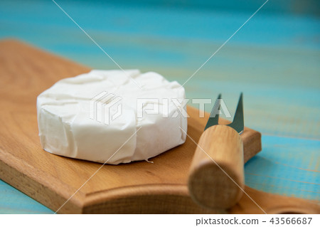 cheese brie or camembert, with a fork 43566687