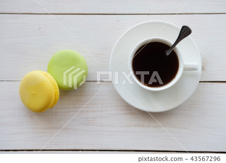 Cup of coffee and macaroon cake 43567296