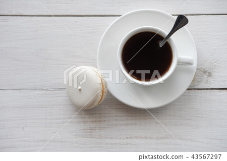 white macaroon cake and white Cup of coffee  43567297