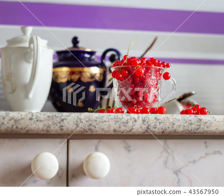 Still life red currant berries in glass mug. Still life red currant berries in glass mug. 43567950