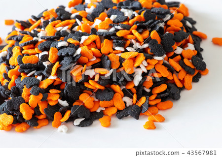 Handful pumpkin, ghost, bat candies for Halloween. Handful pumpkin, ghost, bat candies for Halloween. 43567981
