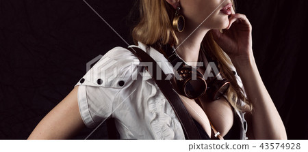 Sexy girl wearing steampunk costume on black 43574928