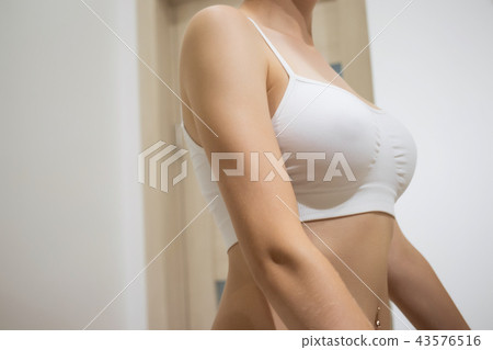 Crop naked woman pulling up panties 43576516