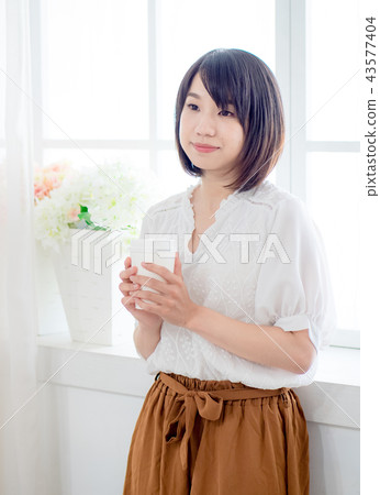 Girl by the window Girl by the window 43577404