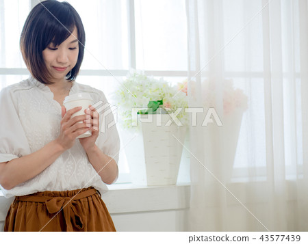 Girl by the window 43577439