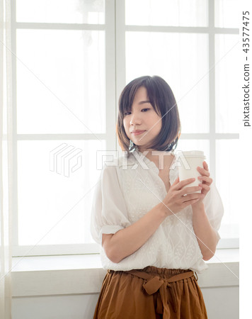 Girl by the window 43577475