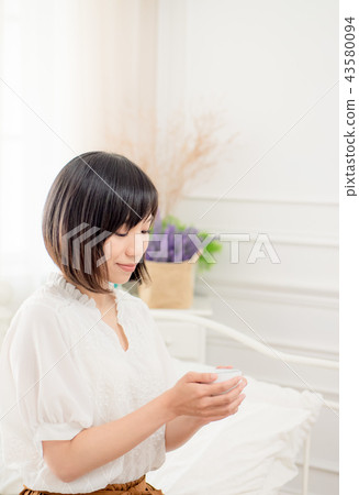 Girl by the window 43580094