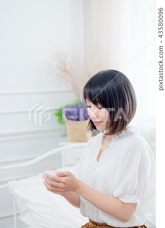 Girl by the window 43580096