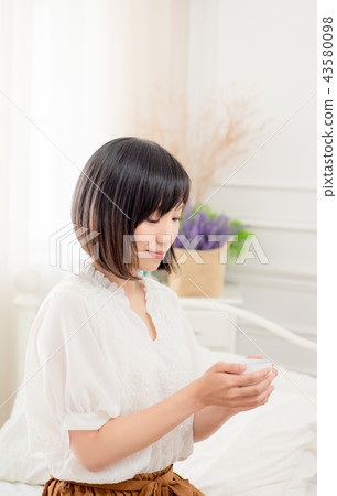 Girl by the window 43580098