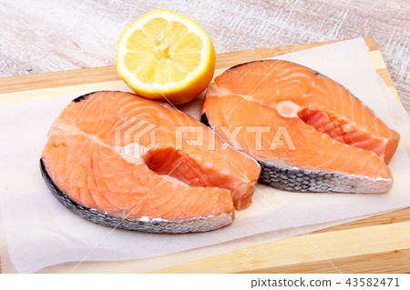 fresh raw salmon with spices and lemon 43582471