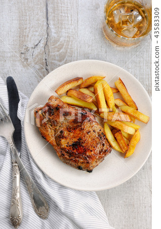 pork steak on dice with potatoes 43583309