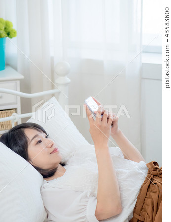 Woman with cell phone Woman with cell phone 43583600
