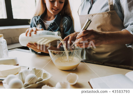 Grandma and Granddaughter Baking Kitchen at Home 43583793
