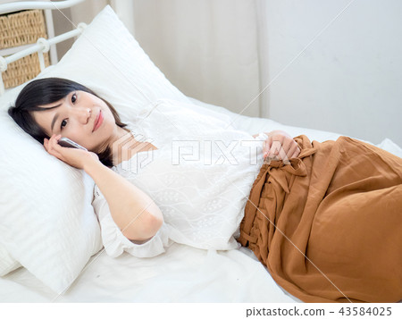 Woman with cell phone Woman with cell phone 43584025