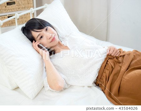 Woman with cell phone Woman with cell phone 43584026