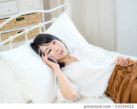 Woman with cell phone Woman with cell phone 43584028