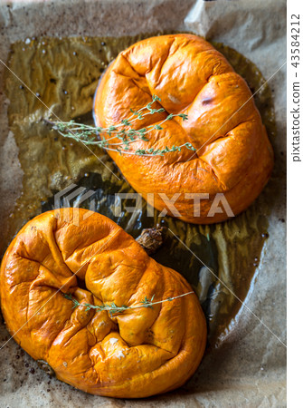 Baked pumpkin with herbs on the tray Baked pumpkin with herbs on the tray 43584212