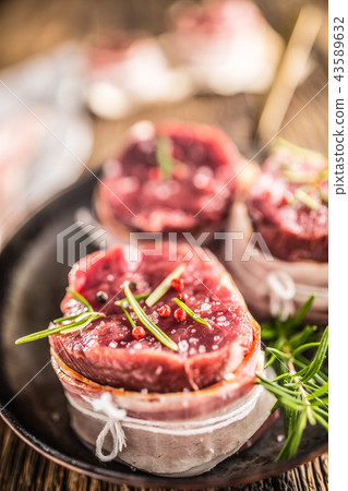 Beef tenderloin steak wrapped in bacon. Beef tenderloin steak wrapped in bacon. 43589632