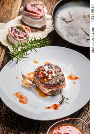 Grilled beef tenderloin steak with chili sauce. Grilled beef tenderloin steak with chili sauce. 43589656