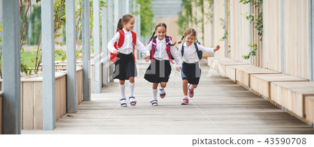 Happy children  girlfriend schoolgirl student elementary school 43590708