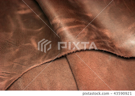 Pieces of brown leather. Texture of natural leather. Pieces of brown leather. Texture of natural leather. 43590921