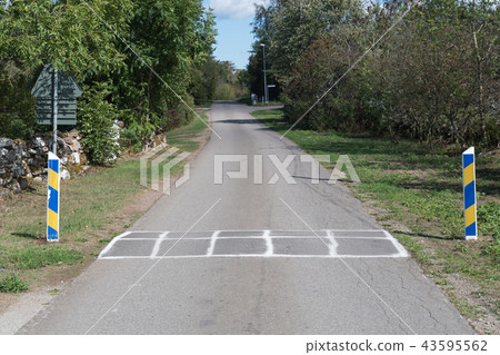 Road bump on a country road Road bump on a country road 43595562