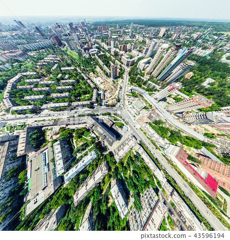 Aerial city view with crossroads and roads, houses, buildings, parks and parking lots. Sunny summer 43596194