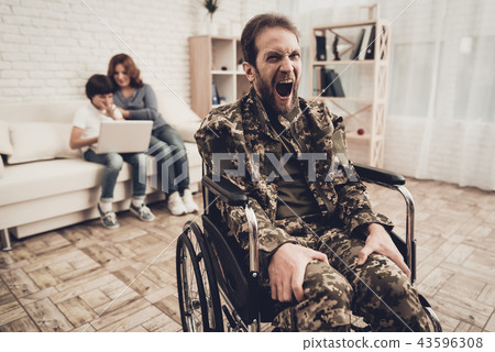 Disabled Soldier In Wheelchair. Suffer From Pain. 43596308