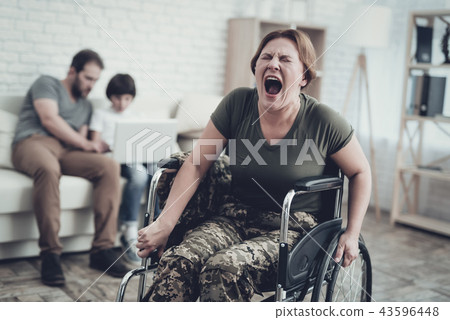 Disabled Soldier In Wheelchair. Suffer From Pain. Disabled Soldier In Wheelchair. Suffer From Pain. 43596448