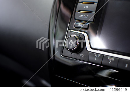 Power button on multimedia dashboard in a car. Power button on multimedia dashboard in a car. 43596449