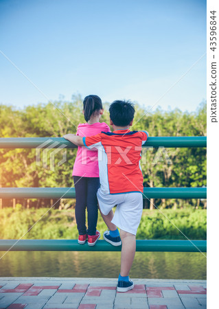 Children smiling and hugging each other. 43596844