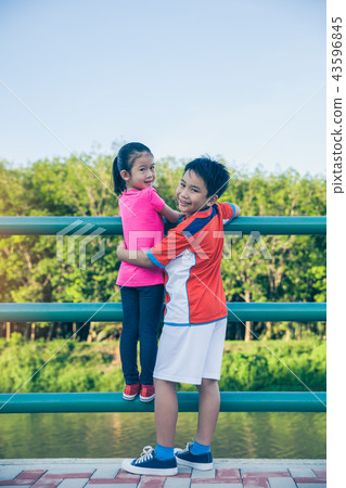 Children smiling and hugging each other. Children smiling and hugging each other. 43596845