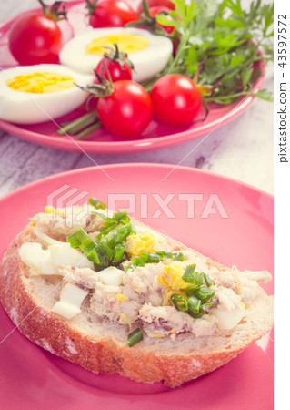 Slice of crusty baguette with fish paste 43597572