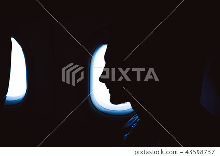 man at the window of the aircraft 43598737