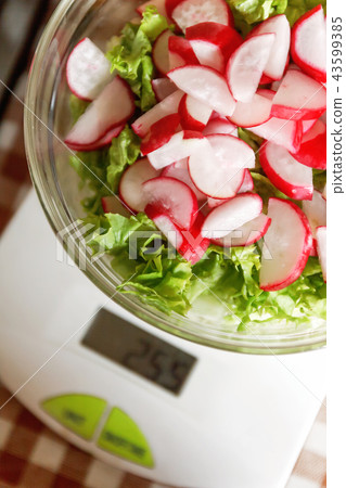 Dietary salad with radish and lettuce in a glass Dietary salad with radish and lettuce in a glass 43599385
