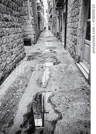 Narrow street in Trogir, Croatia, colorless Narrow street in Trogir, Croatia, colorless 43600010