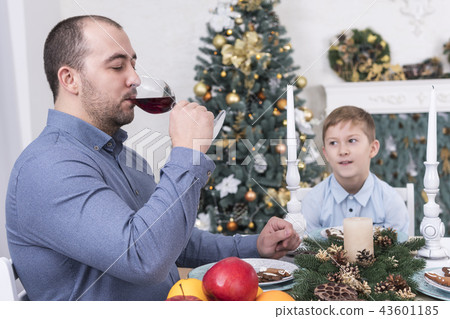 Man is drinking wine from a glass 43601185