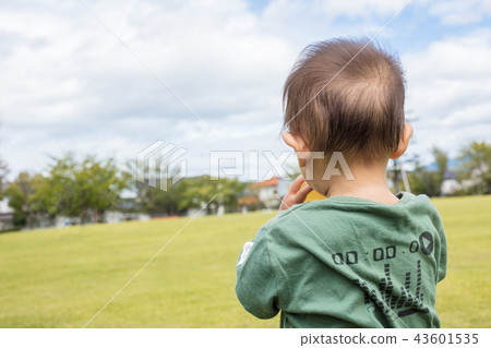 One-year-old child hydration with a plastic bottle One-year-old child hydration with a plastic bottle 43601535