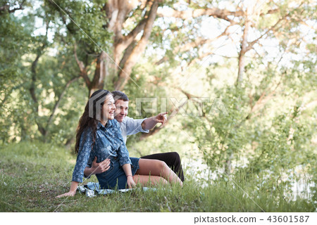 young couple walking in forest, romantic feelings young couple walking in forest, romantic feelings 43601587