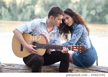 young couple walking in forest, romantic feelings 43601591