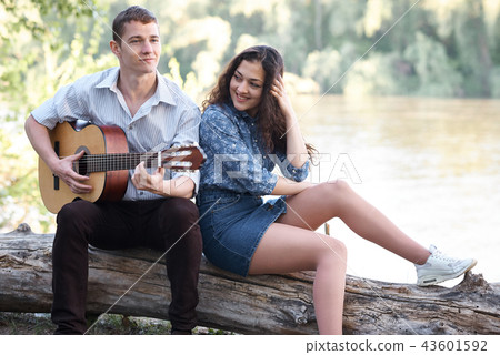young couple walking in forest, romantic feelings 43601592
