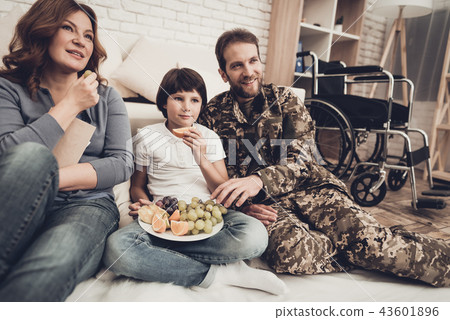 Paralyzed Veteran Is Watching TV With Family. Paralyzed Veteran Is Watching TV With Family. 43601896