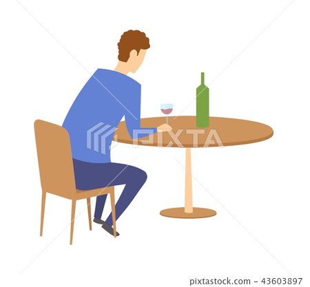 Man sitting by the table with a bottle of wine in front of him. Having a drink in a bar or cafe 43603897