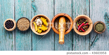 Variety of spices on kitchen table Variety of spices on kitchen table 43603958