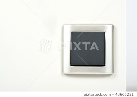 light switch with silver frame on the wall light switch with silver frame on the wall 43605251