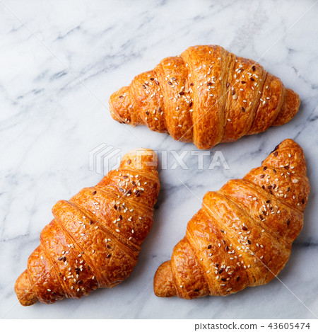 Croissant on marble table. French traditional pastry. Top view. Close up. 43605474