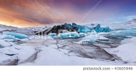 Famous Fjallsarlon glacier and lagoon with icebergs swimming on frozen water. 43605946