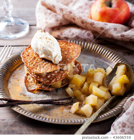 Buckwheat pancakes with poached apples and cream. Buckwheat pancakes with poached apples and cream. 43606559