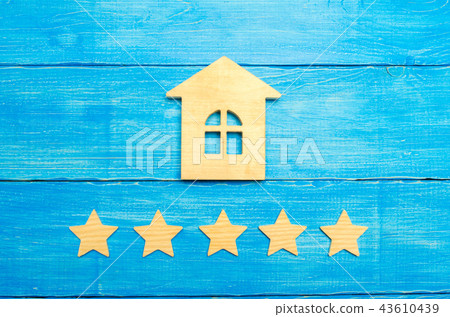Wooden house and five stars on a gray background 43610439